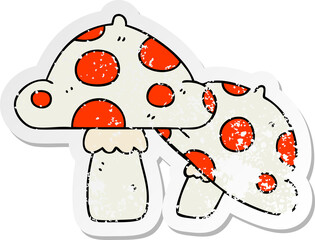 distressed sticker of a quirky hand drawn cartoon toadstools