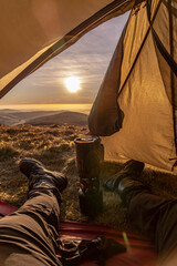 Camping POV out of a tent door at sunrise © UAV4
