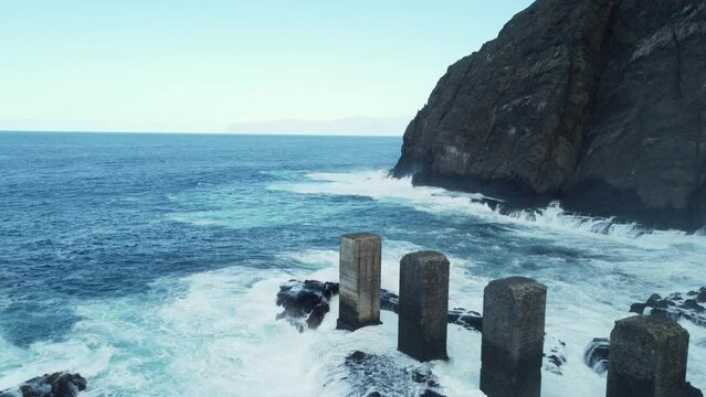 Waves breaking against the Davit of Hermigua in La Gomera aerial view