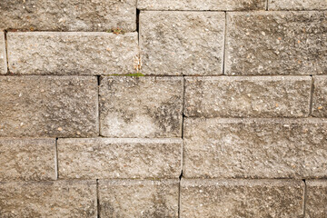 stone wall concrete texture outdoor background that shows solid cement grey background with sonewall granite detail of cobblestone for old solid backdrop with history and vintage culture