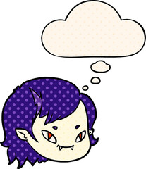 cartoon vampire girl face and thought bubble in comic book style