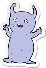 sticker of a cartoon funny little alien