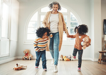 Happy family, grandmother and children play hopscotch in home having fun, enjoy games and relax in bedroom. Bonding, entertainment and grandma with kids for jumping, playing and numbers activity