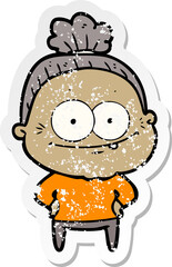 distressed sticker of a cartoon happy old woman
