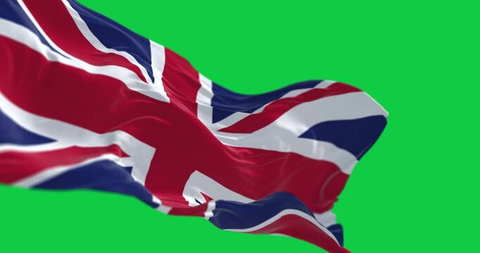 Seamless loop in slow motion of the United Kingdom flag waving isolated on a green background