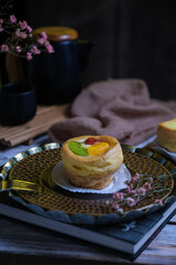 choux cream fruit, kue soes in dark background
