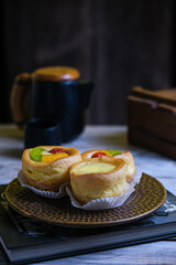 choux cream fruit, kue soes in dark background