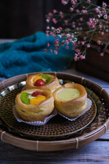 choux cream fruit, kue soes in dark background