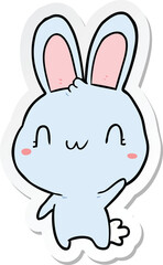 Fototapeta na wymiar sticker of a cartoon rabbit waving