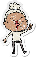 distressed sticker of a cartoon happy old woman