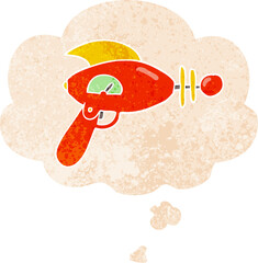 cartoon ray gun and thought bubble in retro textured style