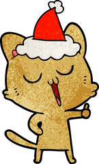 textured cartoon of a cat singing wearing santa hat