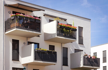 Balcony with Decorated Flower pots of Modern Apartment Building in Europe, Germany. Sun Protection Balconies with Blinds Windows and Awning Window