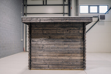 New pinewood shed on factory. black painted storage hut.