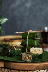 lemper ayam, chicken lemper is glutinous rice cake filled chicken wrapped in banana leaf. Traditional food Indonesia
