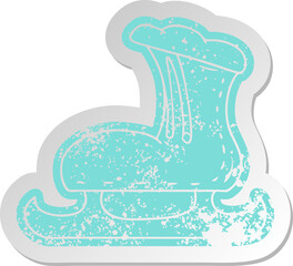 distressed old sticker of an ice skate boot
