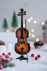 violin toy with artificial flakes in winter concept
