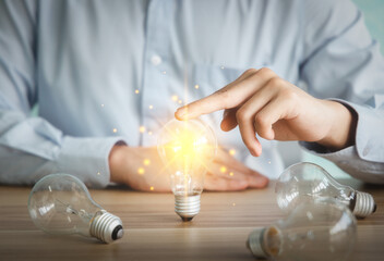 Man holding light bulb. Concept of idea or creativity.