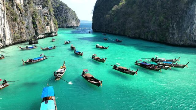 Tourist relaxing on Longtail boats at Koh Phi Phi Don island in Ao Nang, Krabi, Thailand