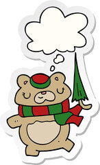 cartoon bear with umbrella and thought bubble as a printed sticker