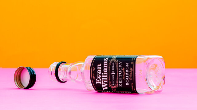 NORWALK, CT, USA -  MARCH, 21, 2023:  Empty bottle from Evan Williams whiskey on colorful background