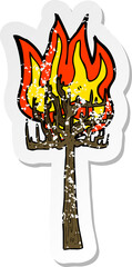 retro distressed sticker of a cartoon tree on fire