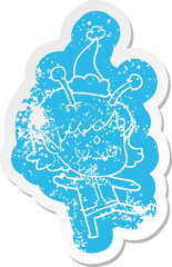 cartoon distressed sticker of a alien girl wearing santa hat