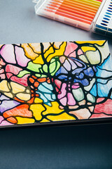 Colorful neurographic drawing on paper with color pencils and markers. Psychological therapy drawings for releasing stress and problem solving