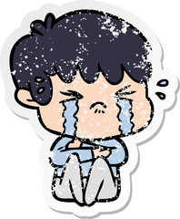 distressed sticker of a cartoon boy crying