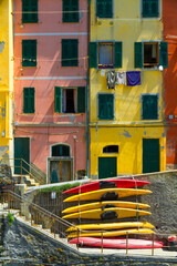 Fototapeta na wymiar Old houses in Riomaggiore with canoes, Cinque Terre, Italy