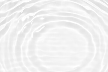 Obraz premium Defocus blurred transparent white colored clear calm water surface texture with splashes and bubbles. Trendy abstract nature background. Water waves in sunlight with copy space. White water shine