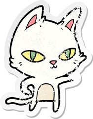 distressed sticker of a cartoon cat staring