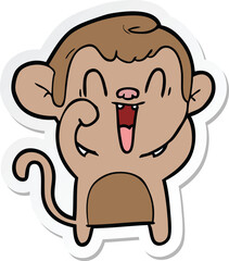 sticker of a cartoon laughing monkey