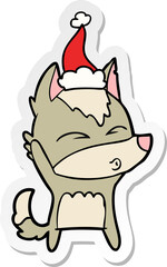 sticker cartoon of a wolf whistling wearing santa hat