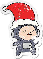 christmas distressed sticker cartoon of kawaii astronaut