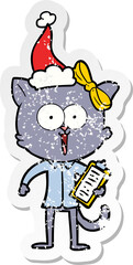 distressed sticker cartoon of a cat wearing santa hat