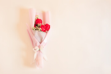 Bouquet of Red rose flowers with white flowers decorated on beige background, Bouquet flowers for Valentines and special days