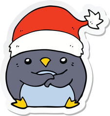 sticker of a cute cartoon penguin wearing christmas hat