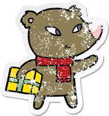 distressed sticker of a cute cartoon christmas bear
