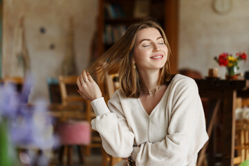 Headshot portrait smart confident smiling millennial woman at home. Attractive young student girl freelancer enjoying life. Childfree concept .