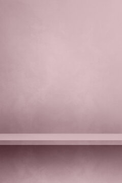 Empty shelf on a light lilac pink concrete wall. Background template. Vertical mockup