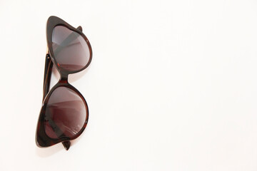 Fototapeta na wymiar Women's designer fashion sunglasses in a plastic frame.