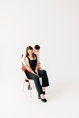 Obraz premium Young couple girl and boy in the studio modern lifestyle portrait. Love and relationship