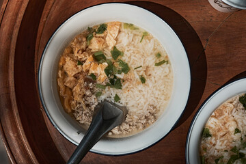 A bowl of congee or porridge with boiled rice