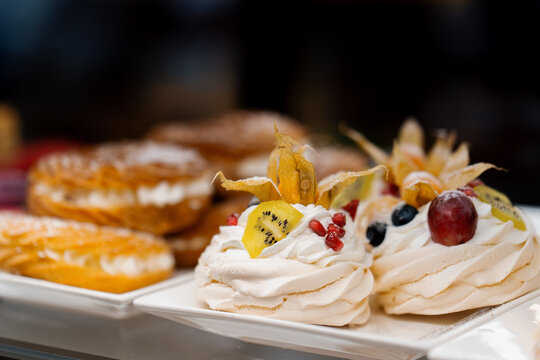 Counter full of delicious buns and pastries in a shop, bakery