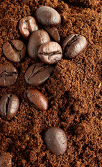 Fototapeta premium Coffee beans and ground powder on white background