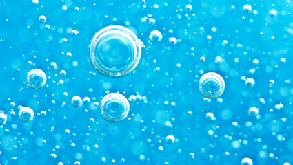 Turquoise background water texture close up with bubbles underwater