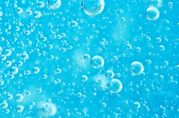 Turquoise background water texture close up with bubbles underwater - 584311920