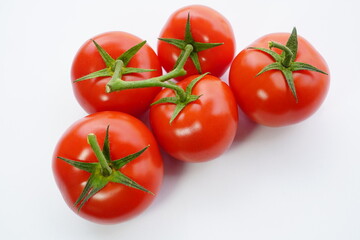 fresh tomatoes isolated on a white background