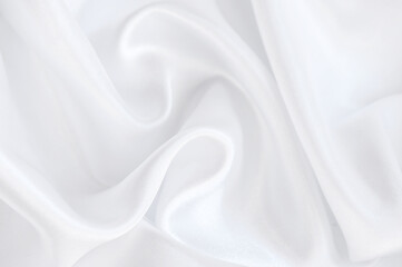 Abstract background of white silky fabric wave